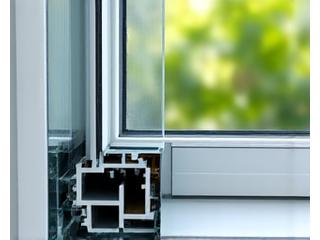 Cross-section of a high-performance, triple-glazed window showing insulation layers.